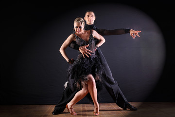 dancers in ballroom isolated on black background