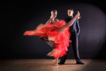 dancers in ballroom isolated on black background