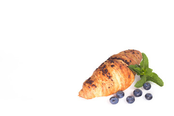 croissant with blueberries isolated on white