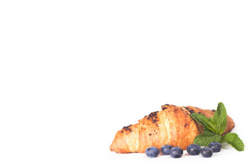 croissant with blueberries isolated on white
