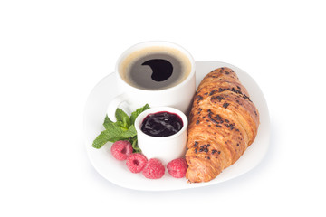 a cup of coffee and croissant isolated on white