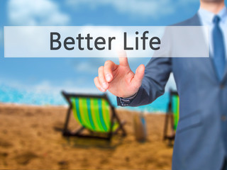 Better Life - Businessman hand pressing button on touch screen interface.