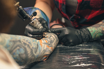 Woman doing picture on arm of man