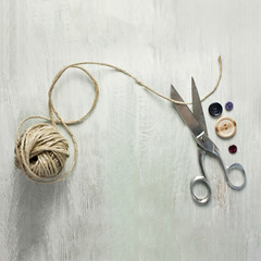 Vintage scissors, roll of twine and buttons, with copyspace