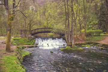 Wooden bridge with waterfall in nature park Vrelo Bosne 2