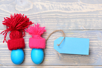 traditional eggs painted in blue color in hats with tag