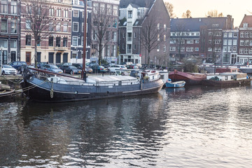 Fototapeta na wymiar Amsterdam City, River, Ships, Sunset