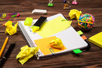 Open notepad with office supplies