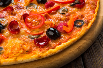 Delicious pizza with salami, mushrooms and olives