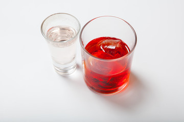 Vodka and a cocktail on a white background