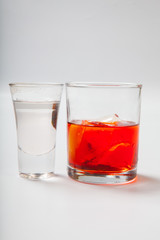 Vodka and a cocktail on a white background