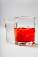 Vodka and a cocktail on a white background