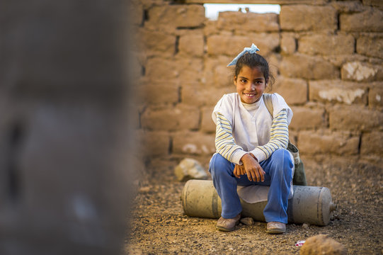 Young cheerful Arabian child looking at camera