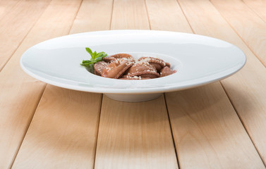 Red beetroot ravioli with blue cheese filling