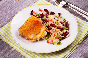 Chicken with Rice, Beans, Bacon and Green Pepper on White Plate