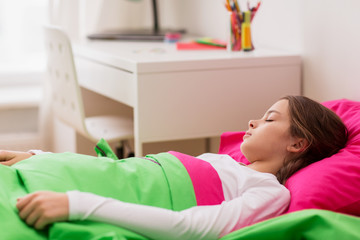 girl sleeping in her bed at home