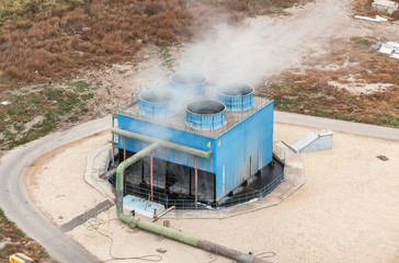 Blue industrial cooling tower at a chemical plant. Top view. Focus on the cooling tower