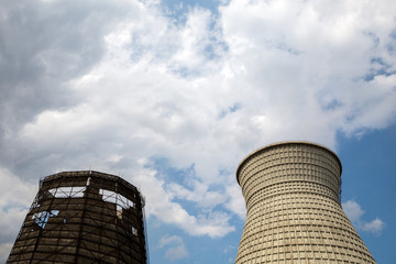 Two towers of a power station against the sky