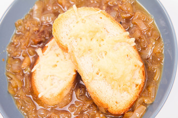 Onion soup with toast on a white background