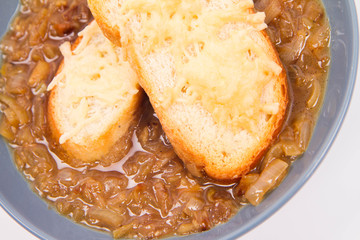 Onion soup with toast on a white background