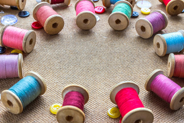 spools of thread laid out in a circle