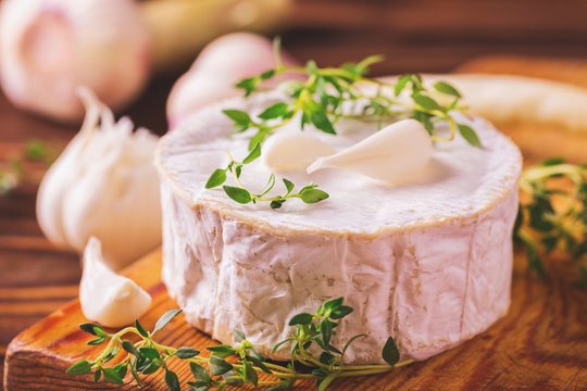French homemade Camembert cheese with thyme and garlic
