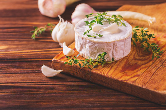 French homemade Camembert cheese with thyme and garlic
