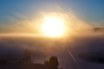 Fototapeta na wymiar Big sun and Mist in sunrise,Sun on Sunrise,sun and mist on mountian,Morning,Sun on during sunrise,