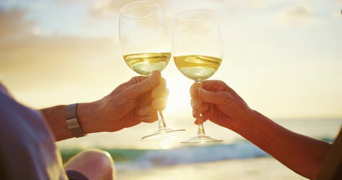 Couple Watching Sunset Enjoying a Glass of Wine