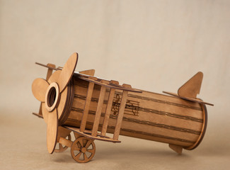 souvenir toy wooden plane on brown background