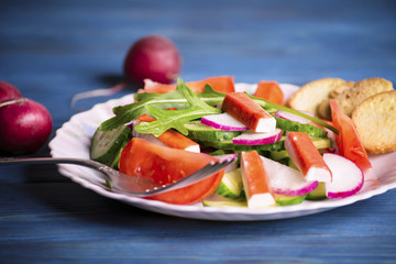 Vegetable salad of crab sticks