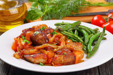 meat stew with vegetables on plate