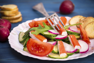 Vegetable salad of crab sticks