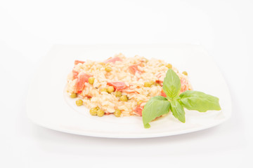 Risotto with tomato and pea on a white background