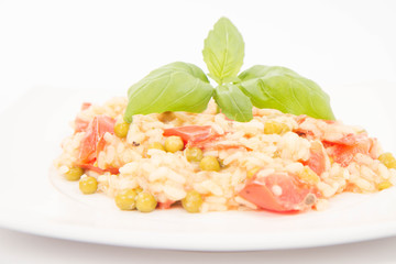 Risotto with tomato and pea on a white background