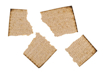 Top view of a broken whole wheat matzo cracker isolated on a white background.