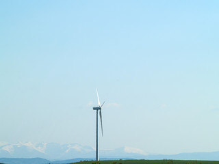 Windmill on countryside generating wind energy