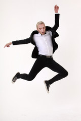 Stylish Man Wearing formal jacket With Bowtie jumping on white background isolated