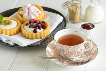 old school style tea at five afternoon service set cake sweet traditional table hotel cheesecake sugar pot china cup