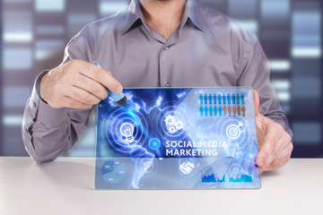 Business, Technology, Internet and network concept. Young businessman working on a virtual screen of the future and sees the inscription: Social media marketing