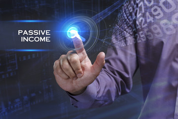 Business, Technology, Internet and network concept. Young businessman working on a virtual screen of the future and sees the inscription: Passive income