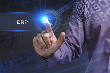 Fototapeta premium Business, Technology, Internet and network concept. Young businessman working on a virtual screen of the future and sees the inscription: ERP