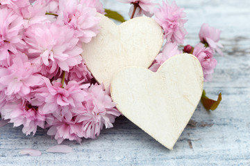 cherry flowers with white heart on wood