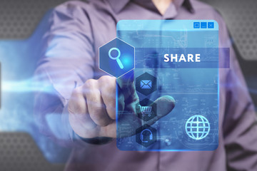 Business, Technology, Internet and network concept. Young businessman working on a virtual screen of the future and sees the inscription: Share