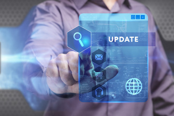 Business, Technology, Internet and network concept. Young businessman working on a virtual screen of the future and sees the inscription: Update