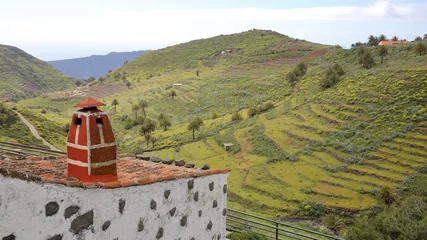 Foto op Aluminium CHIPUDE, LA GOMERA, SPAIN: Green landscape and terraced fields from Chipude with a traditional house in the foreground © Christophe Cappelli