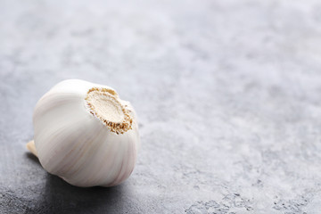 Garlic on the grey wooden table