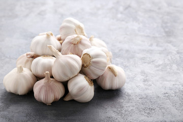 Garlic on the grey wooden table