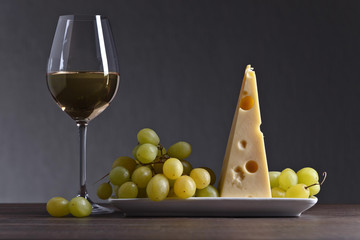 Cheese with grape and white wine