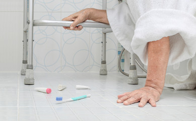 Elderly woman falling in bathroom because slippery surfaces